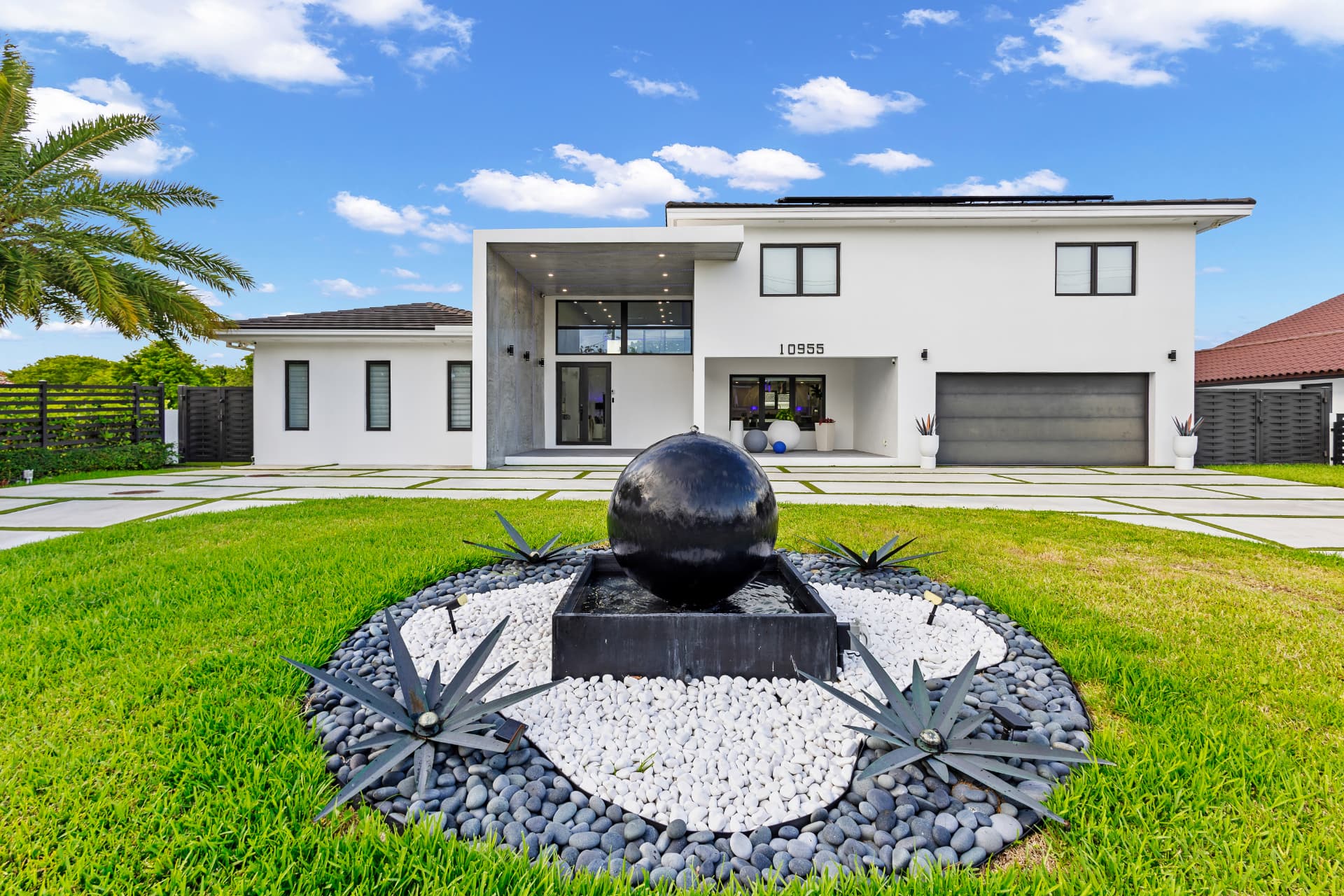 Daytime front elevation with modern water feature