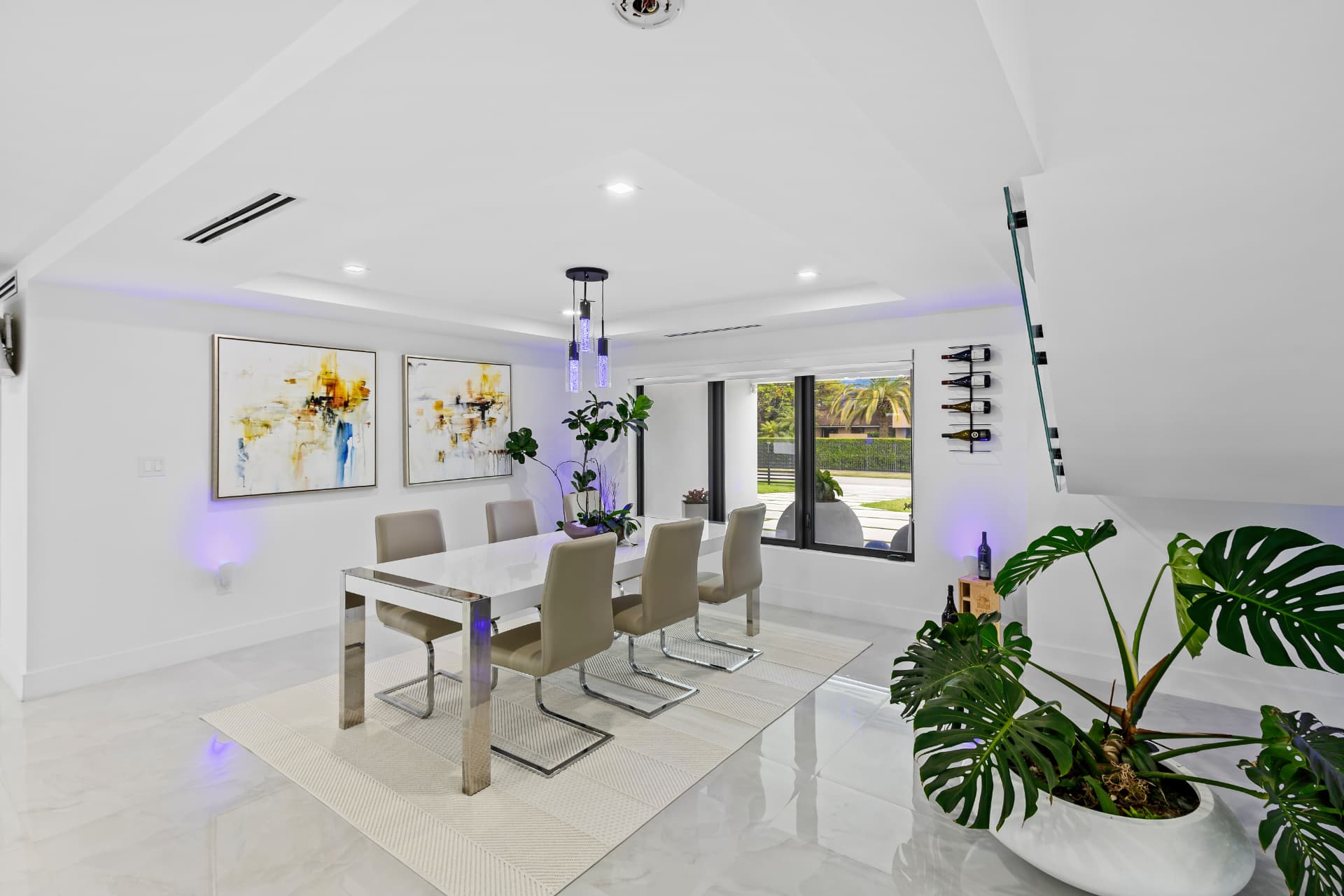 Bright modern dining room with accent lighting
