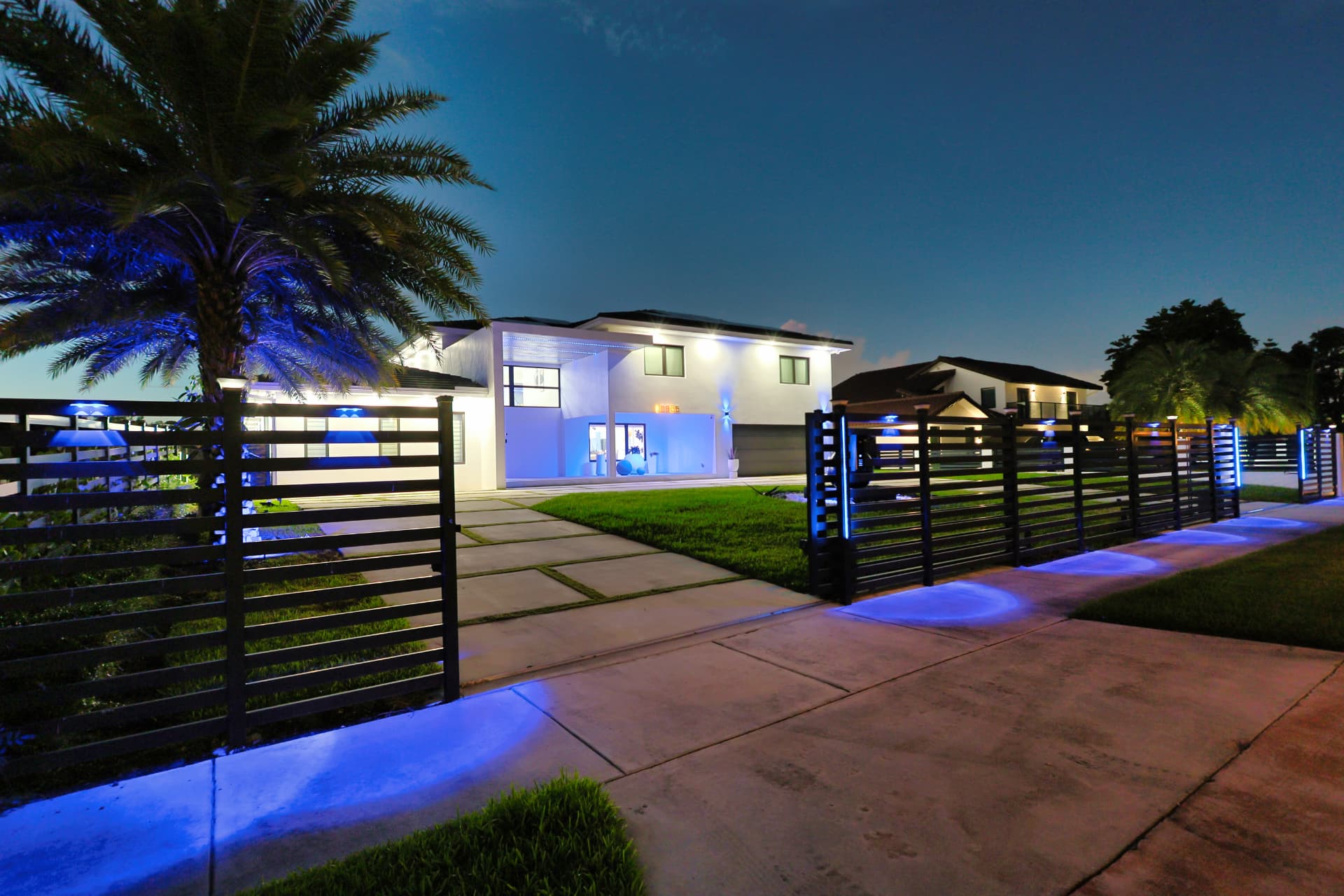 Front elevation at dusk with landscape lighting
